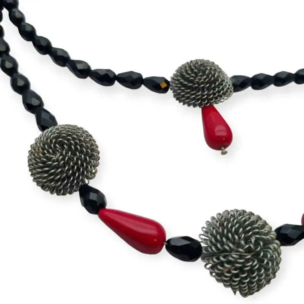 Art Deco choker necklace in black, red and silver with metallic pompoms.
