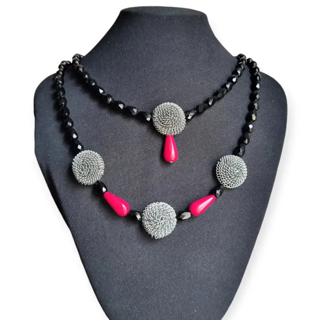 Art Deco choker necklace in black, red and silver with metallic pompoms.