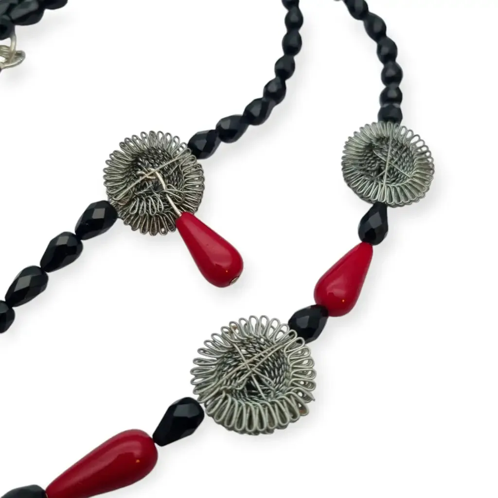 Art Deco choker necklace in black, red and silver with metallic pompoms.