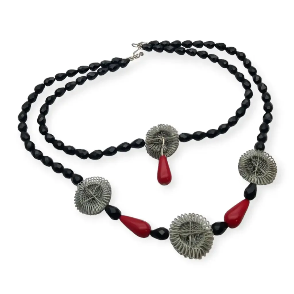 Art Deco choker necklace in black, red and silver with metallic pompoms.