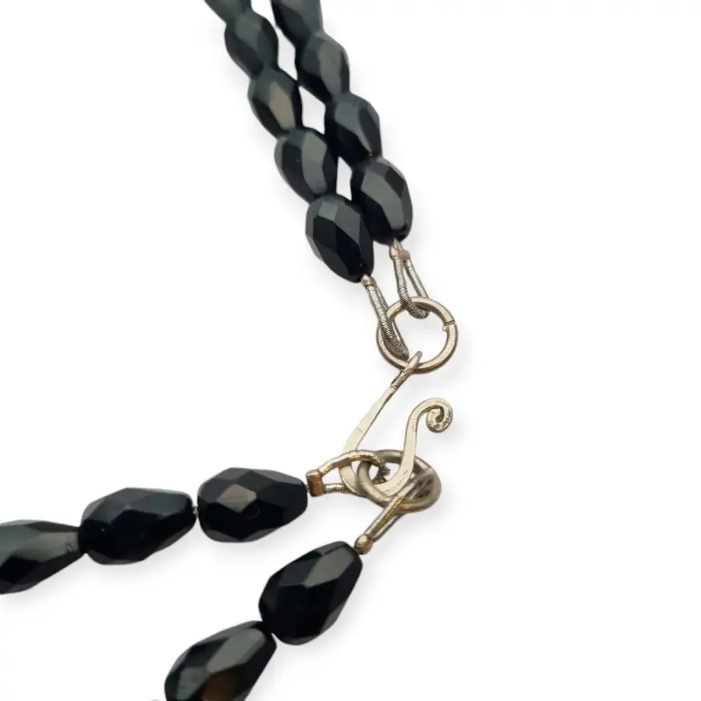 Art Deco choker necklace in black, red and silver with metallic pompoms.