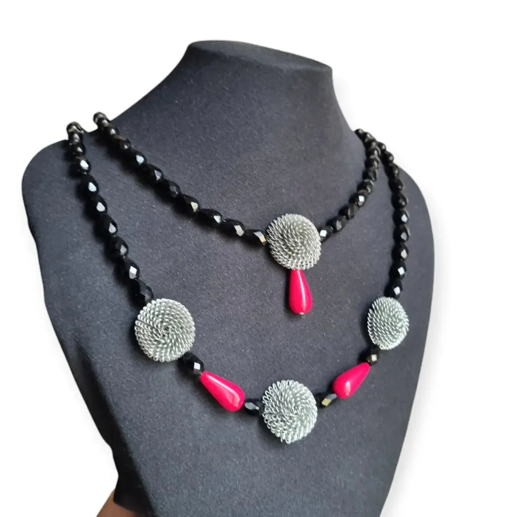 Art Deco choker necklace in black, red and silver with metallic pompoms.
